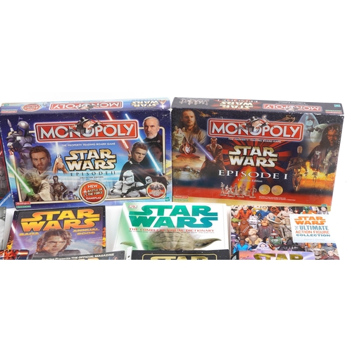 580 - Star Wars memorabilia including a collection of hardback books, calendars, Star Wars Monopoly and St... 