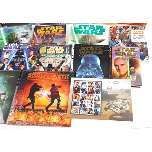 580 - Star Wars memorabilia including a collection of hardback books, calendars, Star Wars Monopoly and St... 