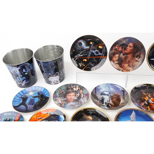 584 - A collection of Star Wars collector's plates together with three tin buckets.