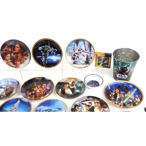 584 - A collection of Star Wars collector's plates together with three tin buckets.