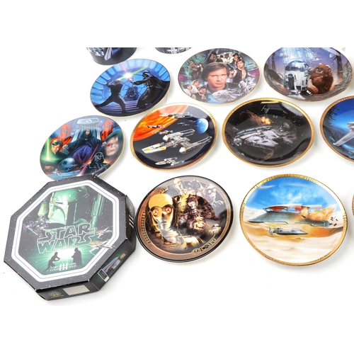 584 - A collection of Star Wars collector's plates together with three tin buckets.