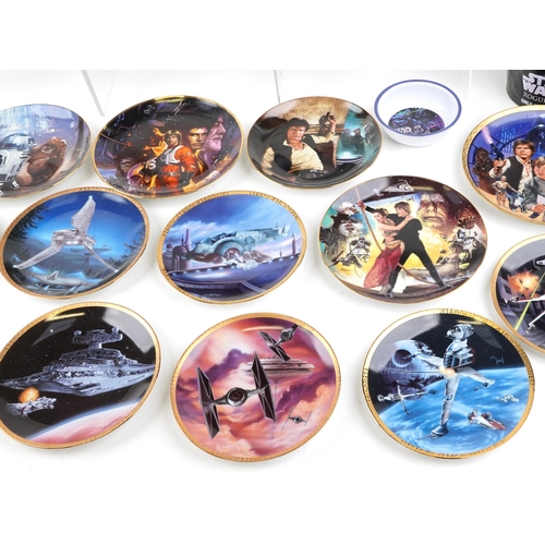 584 - A collection of Star Wars collector's plates together with three tin buckets.