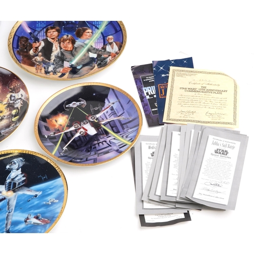 584 - A collection of Star Wars collector's plates together with three tin buckets.