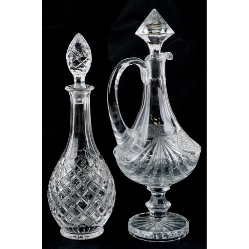 1163 - A large Veristable Cristal claret jug, 40cm high, together with a cut glass decanter, 38cm high.