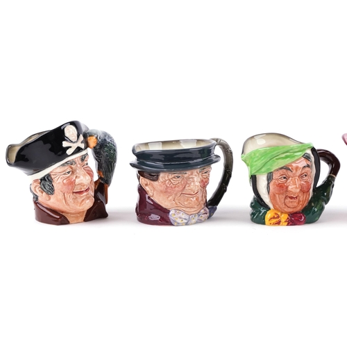 439 - A group of six Royal Doulton character jugs including two Long John Silver and Punch.