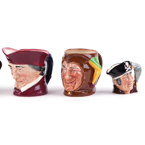 439 - A group of six Royal Doulton character jugs including two Long John Silver and Punch.