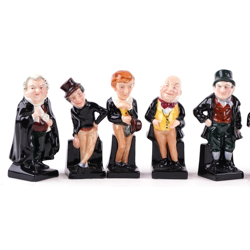 410 - A group of eleven Royal Doulton bone china figures including David Copperfield, Captain Cuttle and T... 