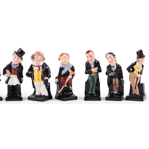 410 - A group of eleven Royal Doulton bone china figures including David Copperfield, Captain Cuttle and T... 