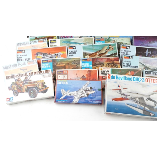 558 - A collection of collector's model kits including Monogram, Hasegawa, Tamiya, Revell and Airfix.