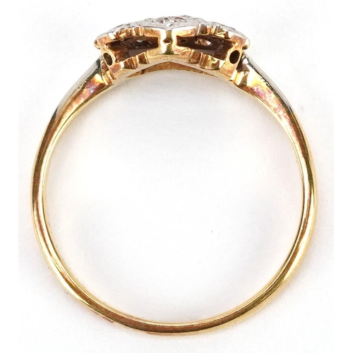 469 - An 18ct gold and platinum diamond ring in the form of a crown, size M, 2.5g.