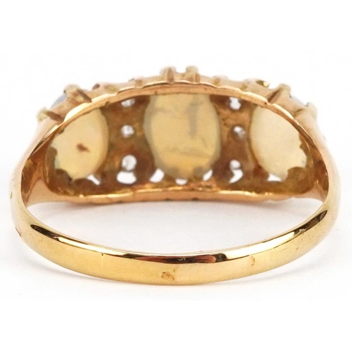 83 - An antique 18ct gold cabochon opal and diamond ring set with six diamonds, size R, 3.4g.