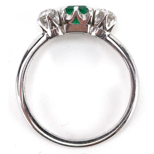 29 - An 18ct white gold emerald and diamond ring, each diamond approximately 3.10mm in diameter, the emer... 