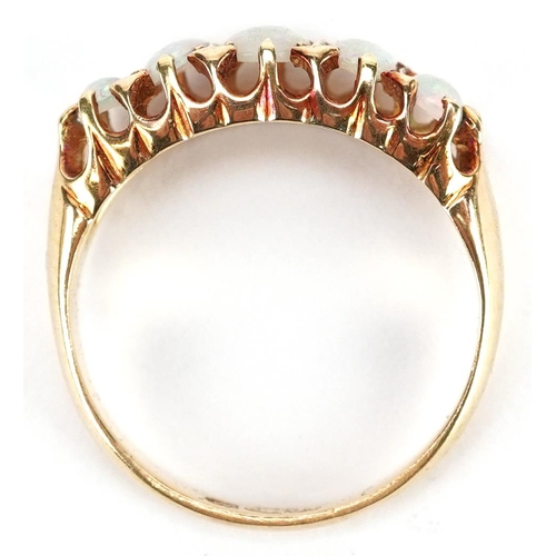 37 - A George V 18ct gold graduated cabochon opal five stone ring, Chester 1915, size K/L, 2.9g.