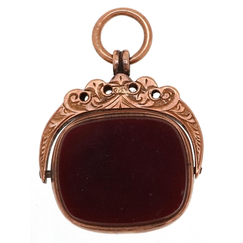 284 - A Victorian 9ct rose gold bloodstone and carnelian spinner fob, Birmingham 1898, 2.2cm high, 4.6g.