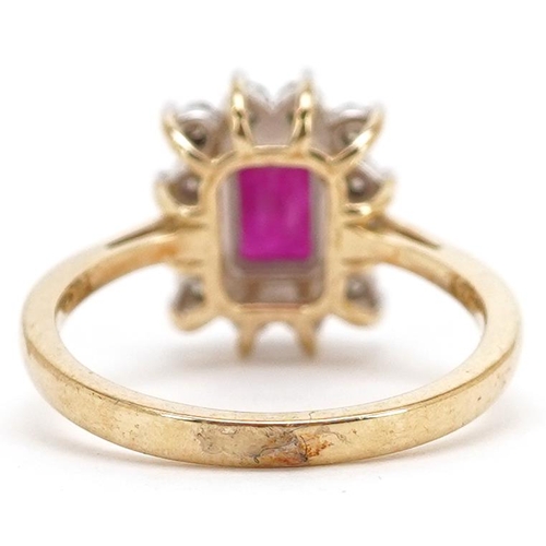 144 - A 9ct gold ruby and diamond cluster ring, total diamond weight approximately 0.06 carat, the ruby ap... 