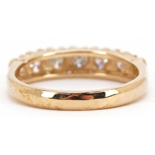 44 - A 9ct gold diamond half eternity ring, total diamond weight approximately 0.40 carat, size M, 2.6g.