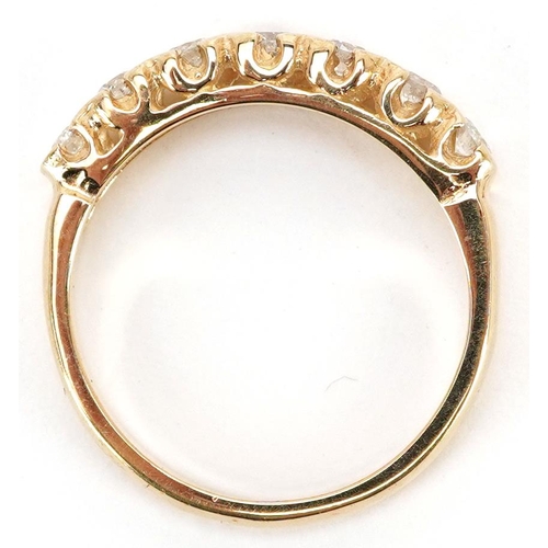 44 - A 9ct gold diamond half eternity ring, total diamond weight approximately 0.40 carat, size M, 2.6g.