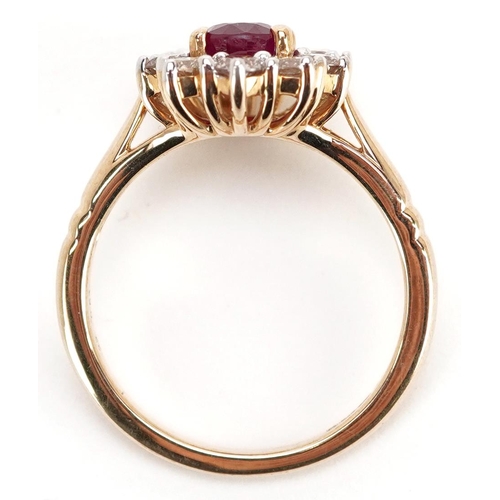 180 - A 9ct gold ruby and diamond cluster ring, total diamond weight approximately 0.83 carat, the ruby ap... 