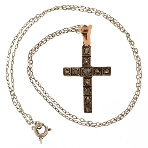 52 - An unmarked gold rose cut diamond cross pendant on a white metal necklace, 3.5cm high and 44cm in le... 