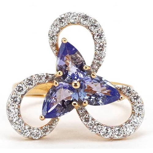 312 - An 18ct gold tanzanite and diamond cocktail ring, total diamond weight approximately 0.55 carat, tot... 