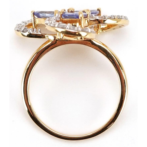 312 - An 18ct gold tanzanite and diamond cocktail ring, total diamond weight approximately 0.55 carat, tot... 