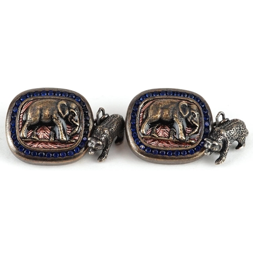 479 - A pair of silver gilt elephant and bear design cufflinks set with blue stones, impressed Russian mar... 