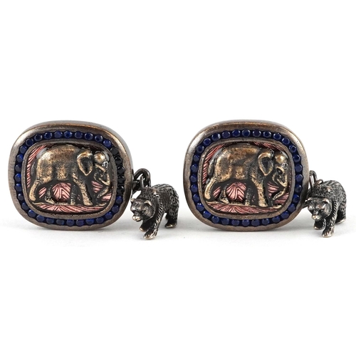 479 - A pair of silver gilt elephant and bear design cufflinks set with blue stones, impressed Russian mar... 