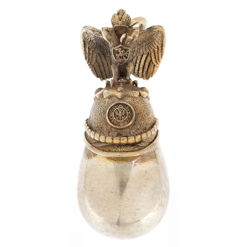 605 - A silver gilt egg pendant in the form of a Russian helmet, impressed Russian marks, 4cm high, 12.5g.