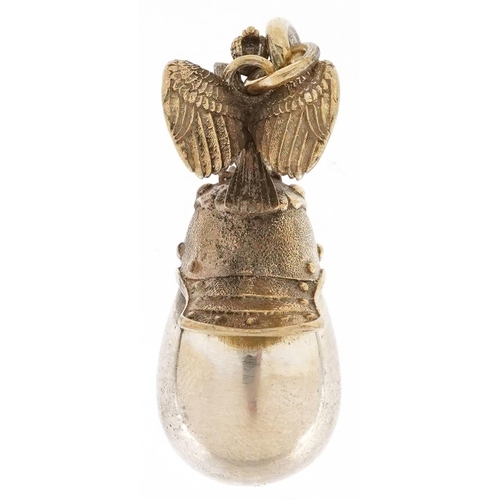 605 - A silver gilt egg pendant in the form of a Russian helmet, impressed Russian marks, 4cm high, 12.5g.