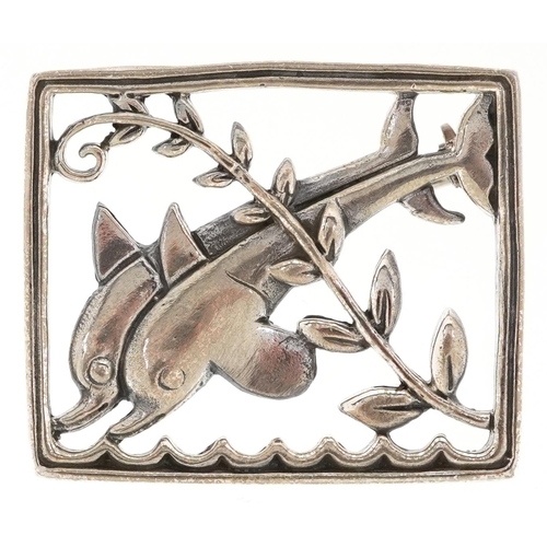 375 - A Modernist sterling silver brooch in the form of dolphins, 3.2cm wide, 9.6g.