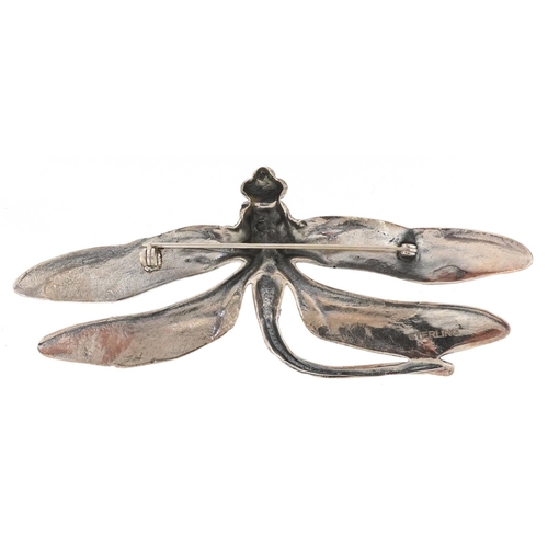 596 - A sterling silver brooch in the form of a dragonfly, 9.5cm wide, 24.0g.