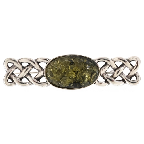 569 - A Celtic design silver and green amber bar brooch, 6.5cm wide, 15.7g.