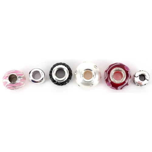 446 - Six silver and glass charms, the largest 1.4cm in diameter, total 13.7g.