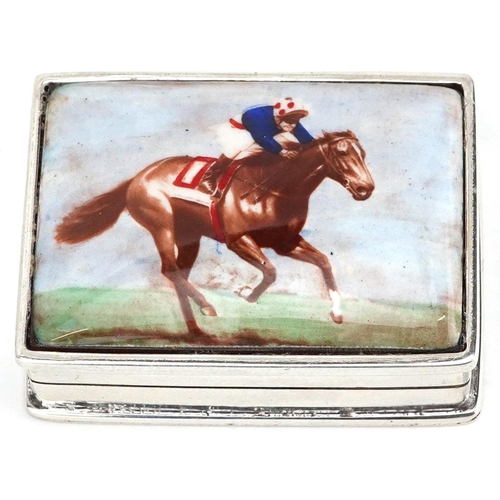 687 - A rectangular silver and enamel pillbox hand painted with a jockey on horseback, 3.5cm wide, 28.5g.