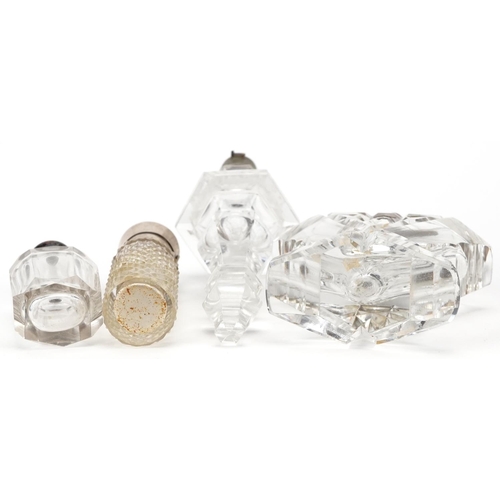 688 - Four antique and later silver mounted glass scent bottles, some Dutch, the largest 15cm high.