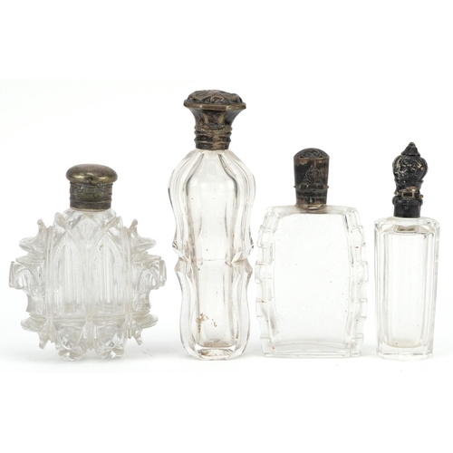 653 - Four antique and later silver mounted glass scent bottles, some Dutch, the largest 11cm high.