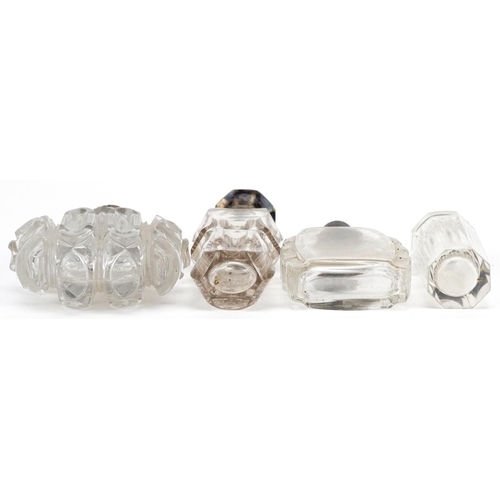 653 - Four antique and later silver mounted glass scent bottles, some Dutch, the largest 11cm high.