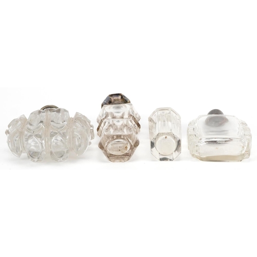 653 - Four antique and later silver mounted glass scent bottles, some Dutch, the largest 11cm high.