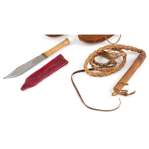 1227 - A group of 20th Native American style items, to include and pair of suede boots, a whip and a knife.