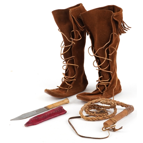 1227 - A group of 20th Native American style items, to include and pair of suede boots, a whip and a knife.