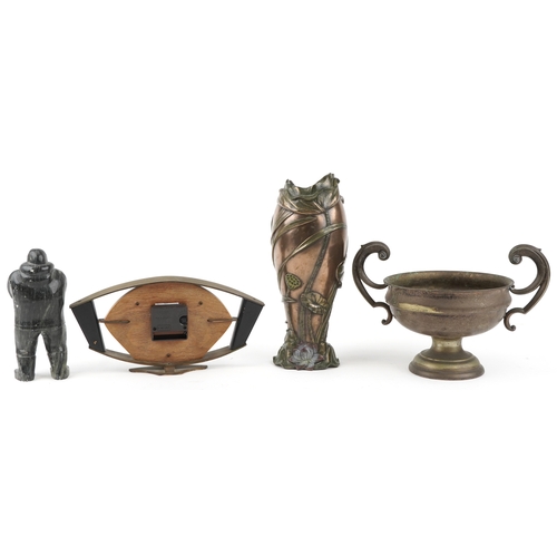 1225 - An Art nouveau style vase, a brass trim handle trophy cup, a mantel clock and a carved hard stone In... 