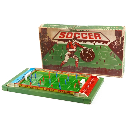 541 - A Chad Valley soccer game, the metal pitch with plastic moveable figures, 59cm in length, boxed.