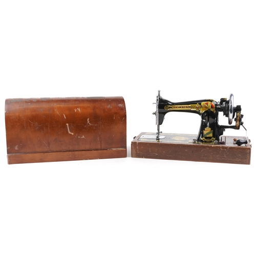 1291 - An early 20th century Mercedes Super Deluxe sewing machine with gilded and engraved decoration, case... 