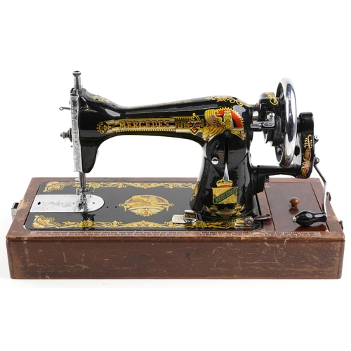 1291 - An early 20th century Mercedes Super Deluxe sewing machine with gilded and engraved decoration, case... 