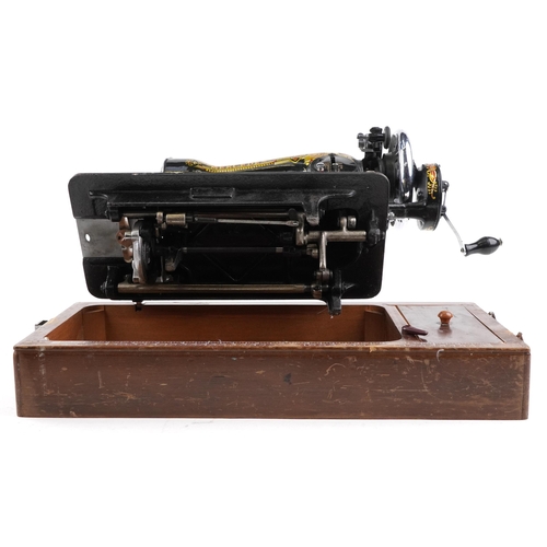 1291 - An early 20th century Mercedes Super Deluxe sewing machine with gilded and engraved decoration, case... 