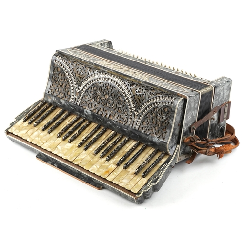 459 - A Settimio Soprani piano accordion, early 20th century, within a green marbled case, 53cm wide.