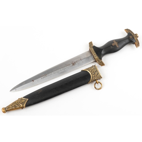 747 - A German military interest dagger with scabbard, 37cm in length.