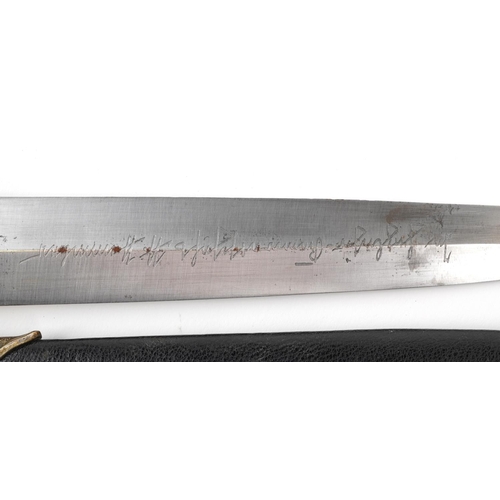 747 - A German military interest dagger with scabbard, 37cm in length.