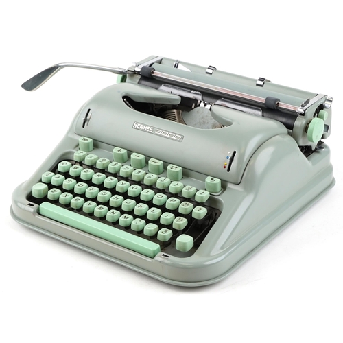 1271 - A Hermes 3000 typewriter finished in green, cased, 32cm wide.