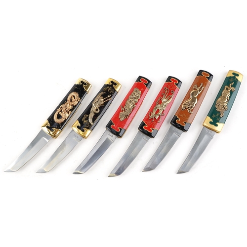 1249 - A group of six Franklin Mint Collector knives, various designs, within a display case, 34cm wide.